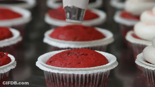 Cupcakes Decorated With Red Frosting And Icing GIF
