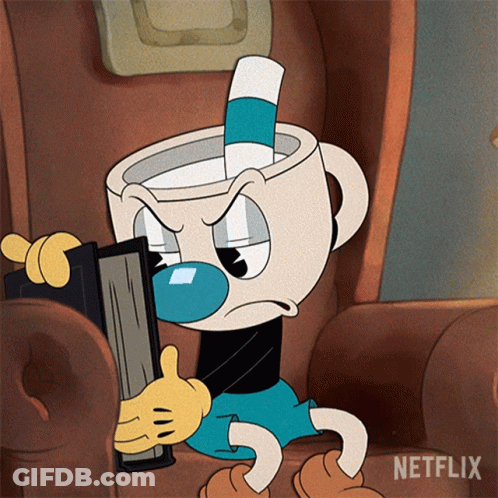 Cuphead Is Sitting In A Chair Holding A Book And Giving A Thumbs Up Sign GIF