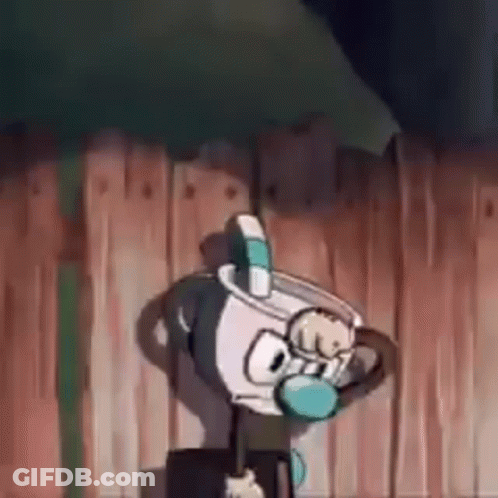 Cuphead Is Standing In Front Of A Wooden Fence . GIF