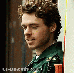 Curly Bearded Man In Green Uniform Saying Exactly GIF