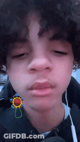 Curly Boy Funny Face With Ear Buds And Earrings GIF
