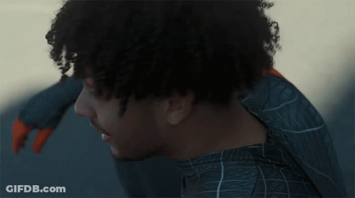 Curly Hair Man In Blue Spider Web Shirt GIF