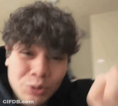 Curly Hair Man Making Funny Face With Hand GIF