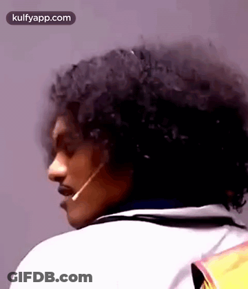 Curly Hair Man With Microphone In Mouth GIF