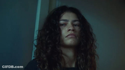 Curly Hair Woman Serious Look At Camera GIF