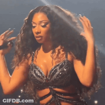 Curly Hair Woman Singing Into Microphone Black Bra GIF