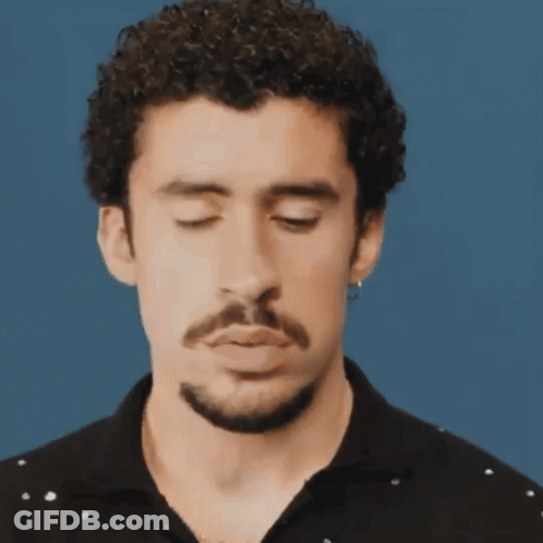 Curly-Haired, Bearded Man Making Funny Face Eyes Closed GIF