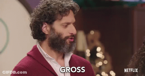 Curly Haired Bearded Man Saying Gross To Woman GIF