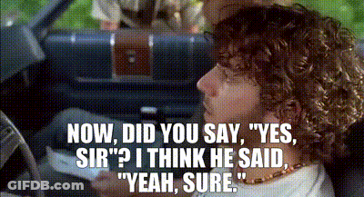 Curly Haired Man In Driver's Seat Talking GIF