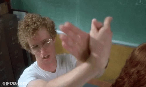 Curly Haired Man In Glasses Reaching To Dog GIF