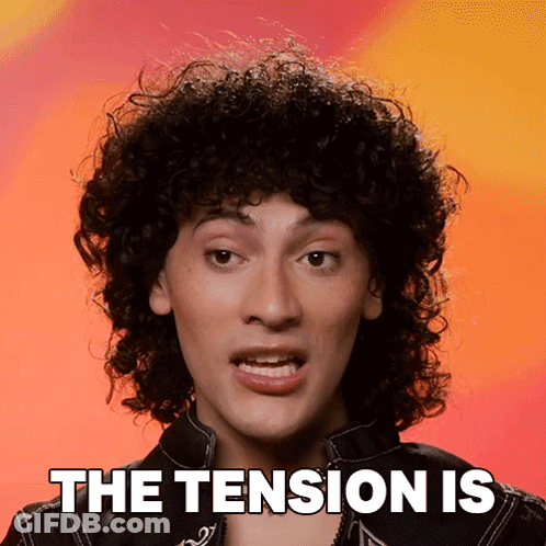 Curly Haired Man Saying The Tension Is GIF