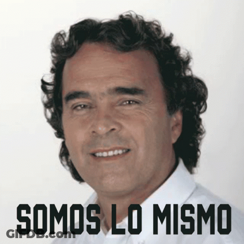 Curly-Haired Man Smiling In Front Of Somos Lo Mismo Sign GIF