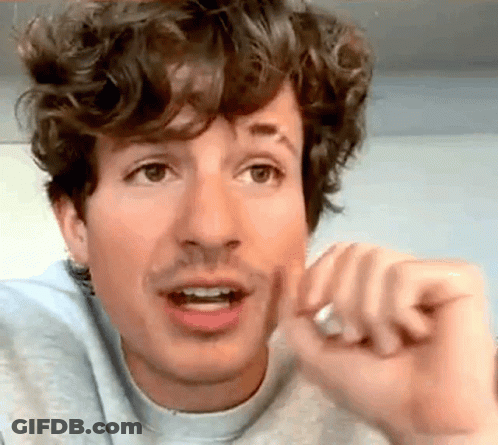 Curly-Haired Man With Mustache Making Funny Face GIF