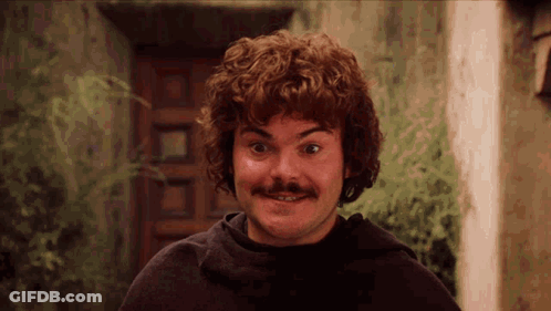 Curly Haired Man With Mustache Smiling At Door GIF