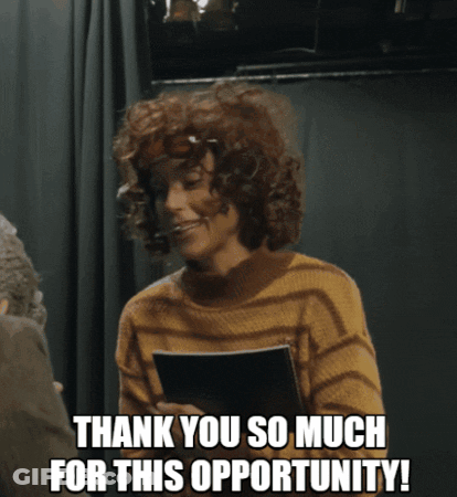 Curly Haired Woman Holding Paper Saying Thank You GIF
