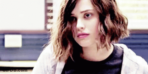 Curly Haired Woman In Black Shirt And White Sweatshirt GIF