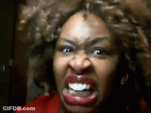 Curly-Haired Woman Making Angry Face GIF