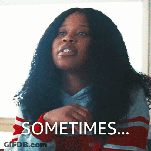 Curly Haired Woman Saying Sometimes In Striped Shirt GIF