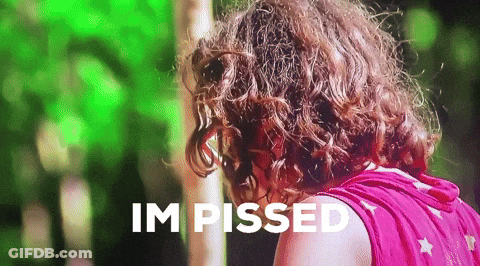 Curly Haired Woman Says Im Pissed Green Background GIF