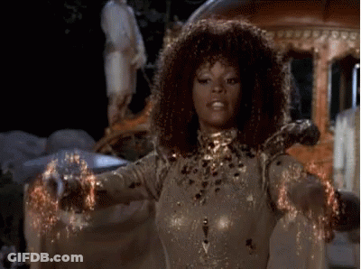 Curly Haired Woman With Arms Outstretched By Carriage GIF