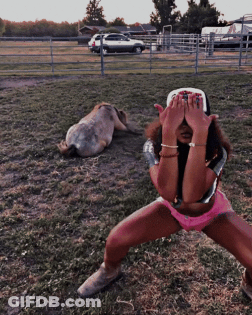 Curly Woman With Cap And Pink Shorts Get Low GIF