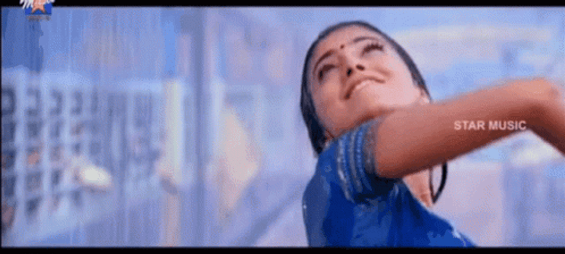 Cute Bollywood Couple Dancing In The Rain GIF