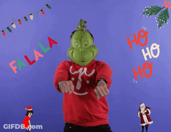Cute Christmas Wearing The Grinch Mask GIF