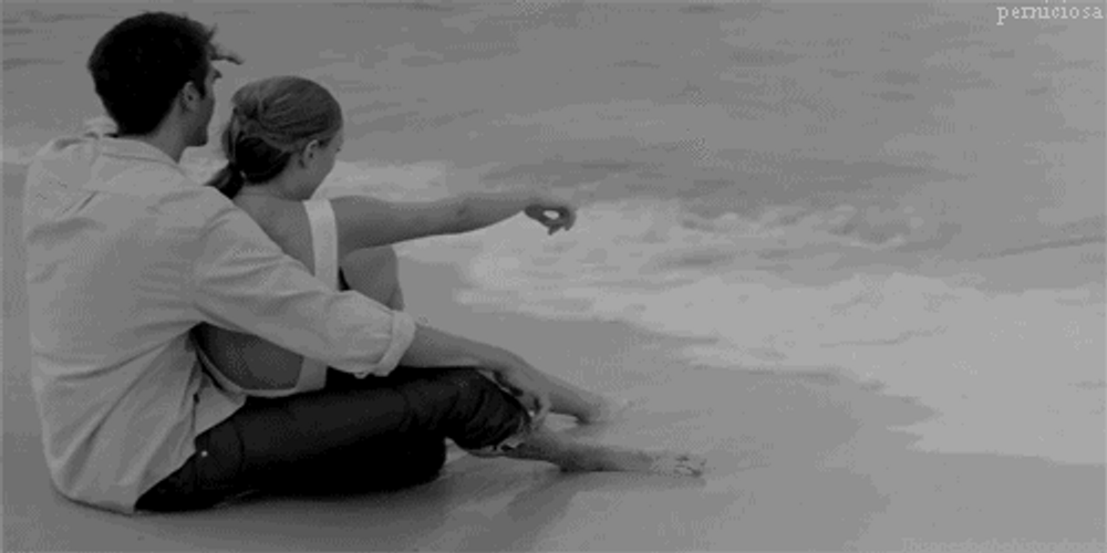 Cute Couples Sitting On The Beach GIF