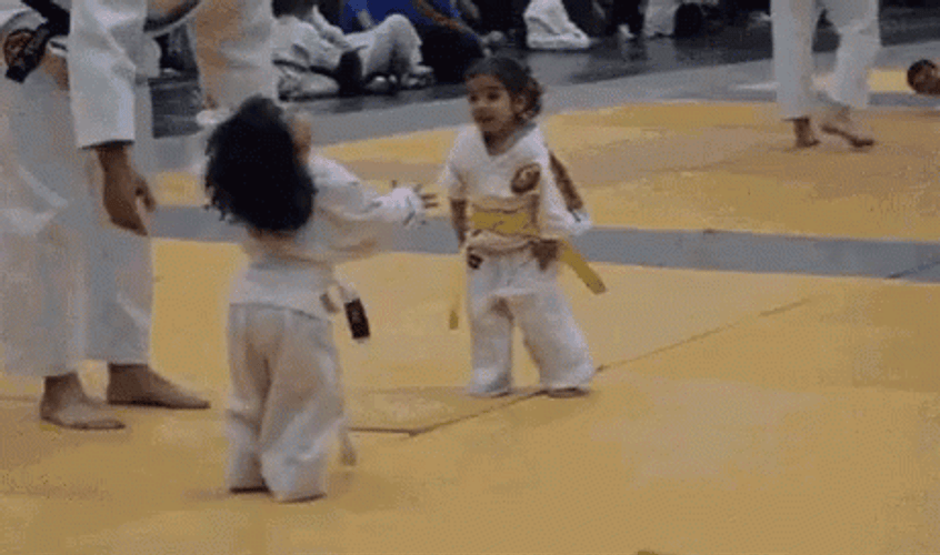Cute Karate Kid Hug Fight GIF