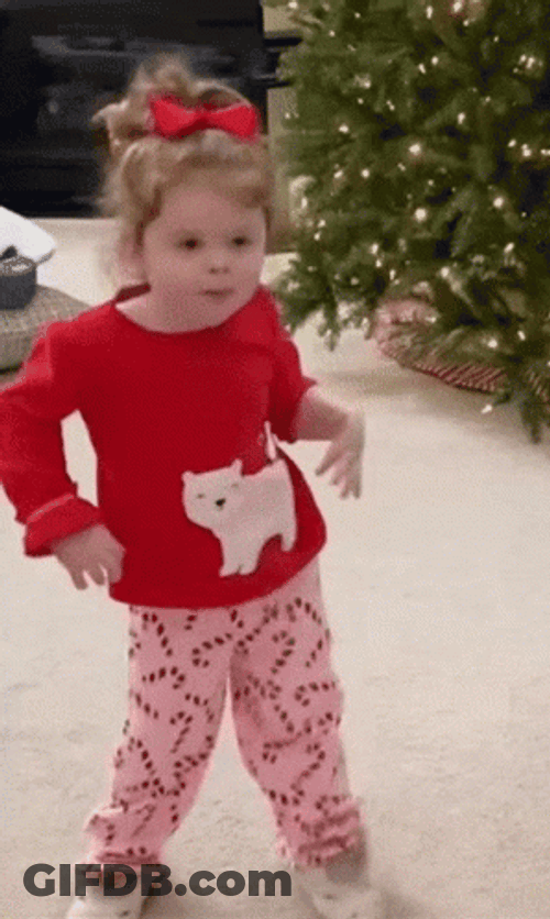 Cute Kid In Her Christmas Outfit Excited Dance GIF