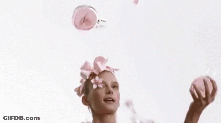 Cute Lady Juggling Make Up GIF