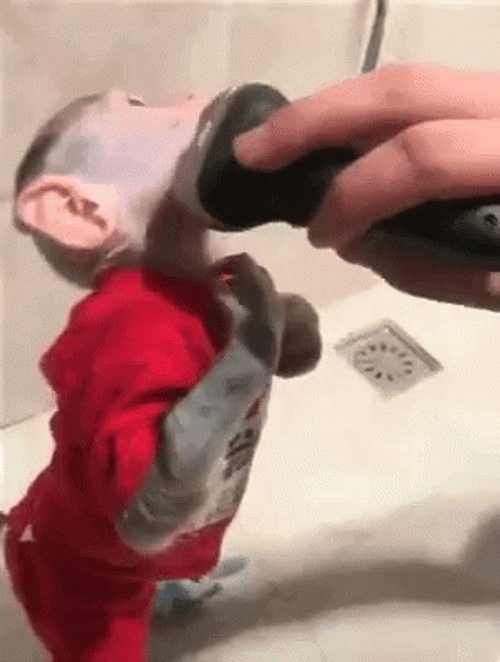 Cute Monkey Tries Shaving In Face GIF
