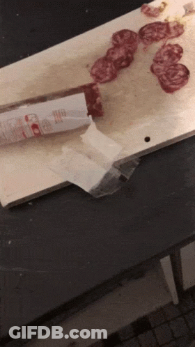 Cutting Board With Meat And Knife Labeled Beef GIF