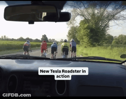 Cyclists Riding With New Tesla Roadster In Action GIF