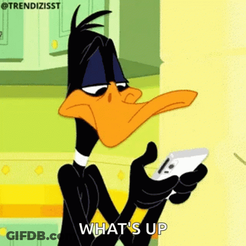 Daffy Duck Is Holding A Cell Phone In His Hand And Saying What 'S Up . GIF