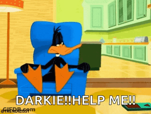 Daffy Duck Sitting In Chair Saying Darkie Help Me GIF