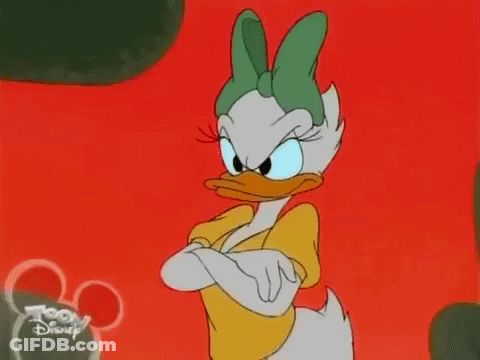 Daisy Duck Is Standing With Her Arms Crossed And Looking Angry In A Cartoon . GIF