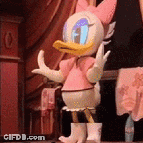 Daisy Duck Wearing A Pink Shirt And White Boots GIF
