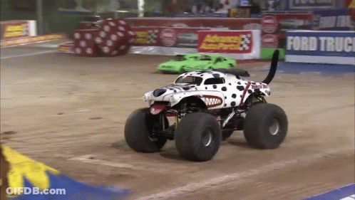 Dalmatian Monster Truck Driving Past Ford Truck Sign GIF