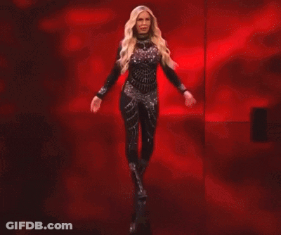 Dana Brooke Is Standing In Front Of A Red Banner That Says Raw GIF