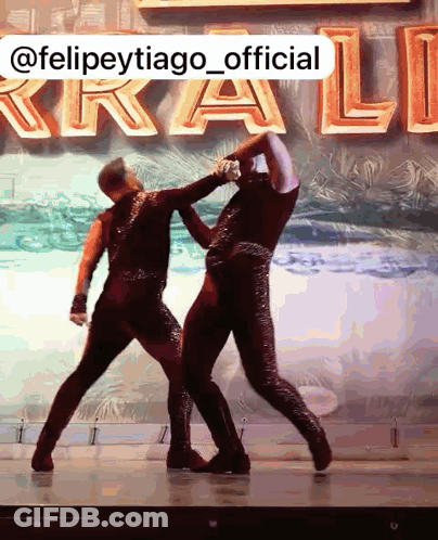 Dancers Dancing In Front Of @Felipetytiago_official Sign GIF