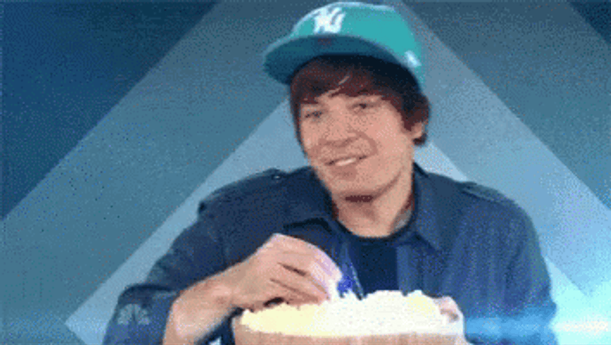 Dancing & Eating Popcorn GIF