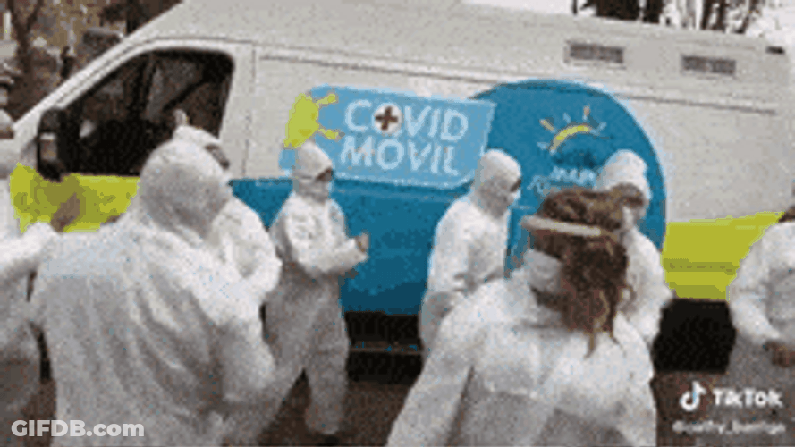 Dancing Group Of Hazmat Suit Wearers GIF