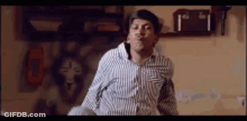 Dancing Man In Striped Shirt Making Funny Face GIF