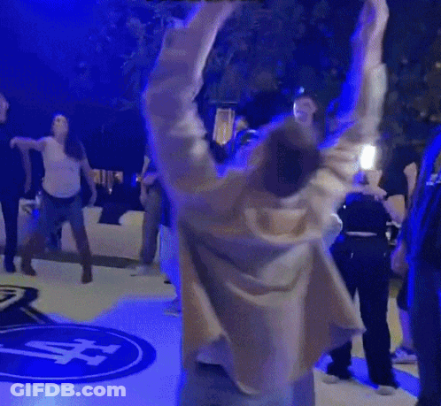 Dancing People By Sign Saying A GIF