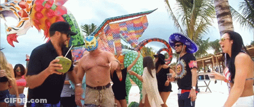 Dancing People On Beach With Luchador Mask GIF