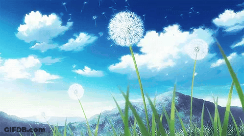Dandelion Blowing In Wind With Mountains GIF