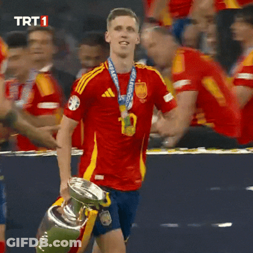 Dani Olmo Proudly Strolls With Trophy GIF