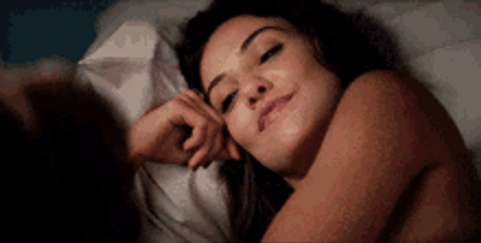 Danielle Campbell Smiling In Bed GIF