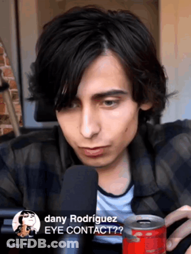 Dany Rodriguez Talking Into Microphone Holding Coke GIF
